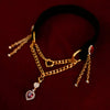 Gold chain black velvet necklace with heart-shaped pendant on a dark background