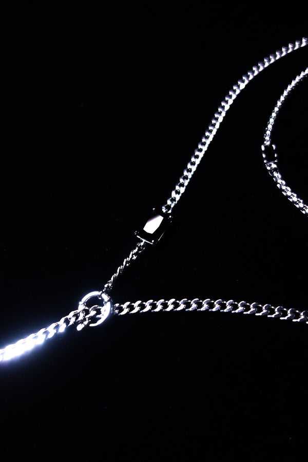 Black crystal and central ring details on silver-tone chains