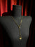 Gold spider crystal pendant close-up