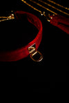 Optional gold-tone back D-ring detail on scarlet velvet choker