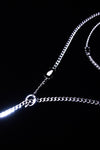 Black crystal and central ring details on silver-tone chains