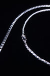 Faceted black crystal accent on close-fitting chain