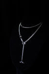 OBSIDIAN ORBIT layered silver-tone necklace set on display