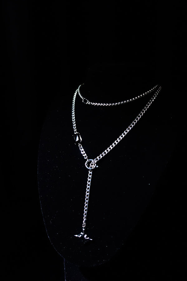 OBSIDIAN ORBIT layered silver-tone necklace set on display
