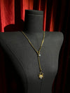 Gold spider crystal pendant close-up