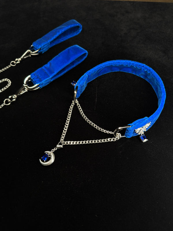 Royal blue velvet choker and cuffs set angled flat lay