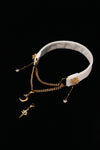 FROSTED STELLA white snowflake choker with gold-tone chains and star and moon drops