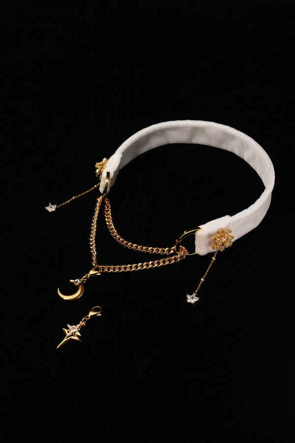 FROSTED STELLA white snowflake choker with gold-tone chains and star and moon drops