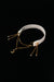 IVORY REVERIE white choker with layered gold-tone chains, a crescent moon and side tassels