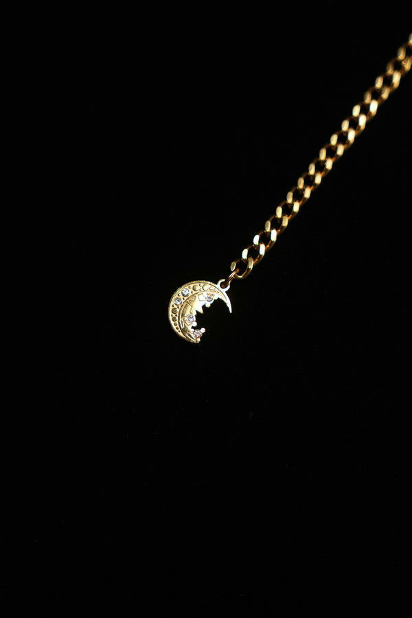Detailed crescent moon charm at the end of the necklace