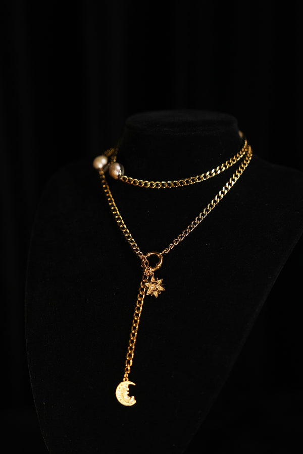 MY CONSTANT STAR necklace wrapped around the neckline for a layered silhouette