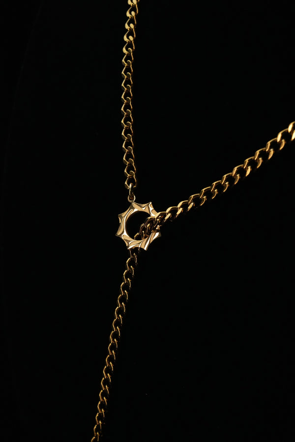 Detail of the sun ring and hanging chain