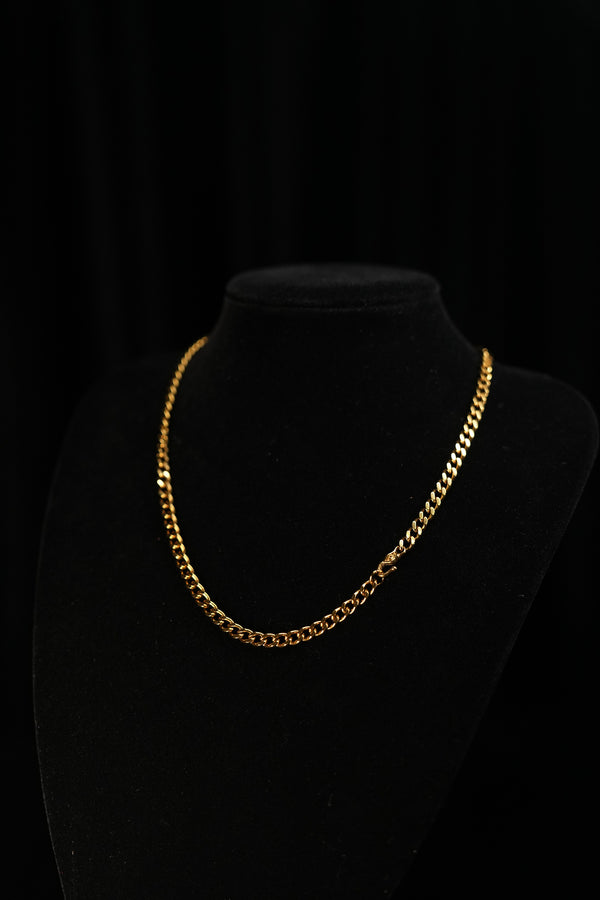 Verdant Relic gold-tone Cuban chain worn alone