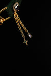 Gold-tone chain tassels with cross-shaped and crystal charms