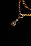 Oval purple zircon pendant close-up