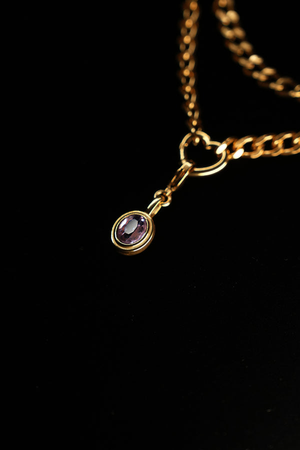 Oval purple zircon pendant close-up