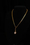 Gold-tone Cuban chain with detachable purple zircon pendant