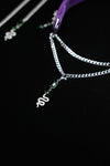 Pavé serpent pendant and emerald-green zircon details