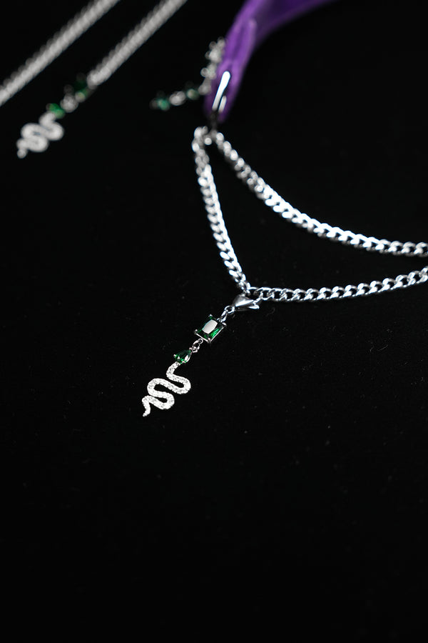 Pavé serpent pendant and emerald-green zircon details